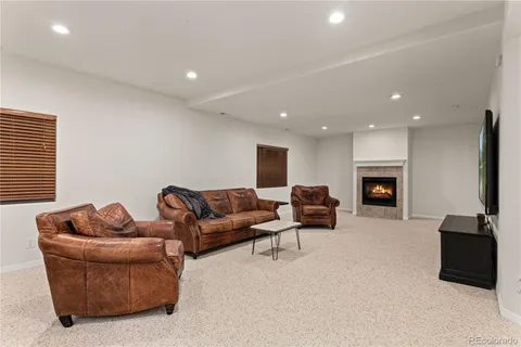 a view of a house with backyard porch and sitting area