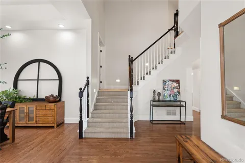 a view of entryway and hall with wooden floor