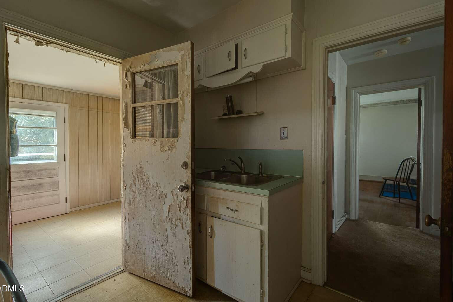 128 Nelson Street Durham, NC 27707 - Photo 13 of 23 a kitchen with a refrigerator and a sink