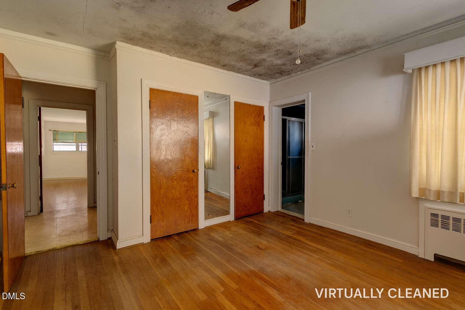 128 Nelson Street Durham, NC 27707 - Photo 16 of 23 an empty room with closet and windows