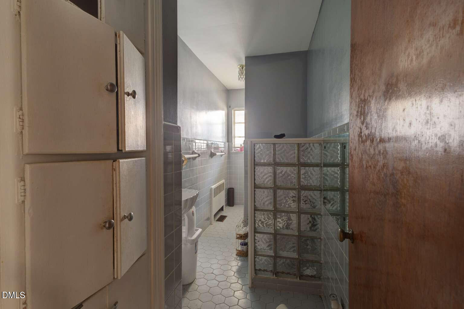 128 Nelson Street Durham, NC 27707 - Photo 19 of 23 a bathroom with a shower