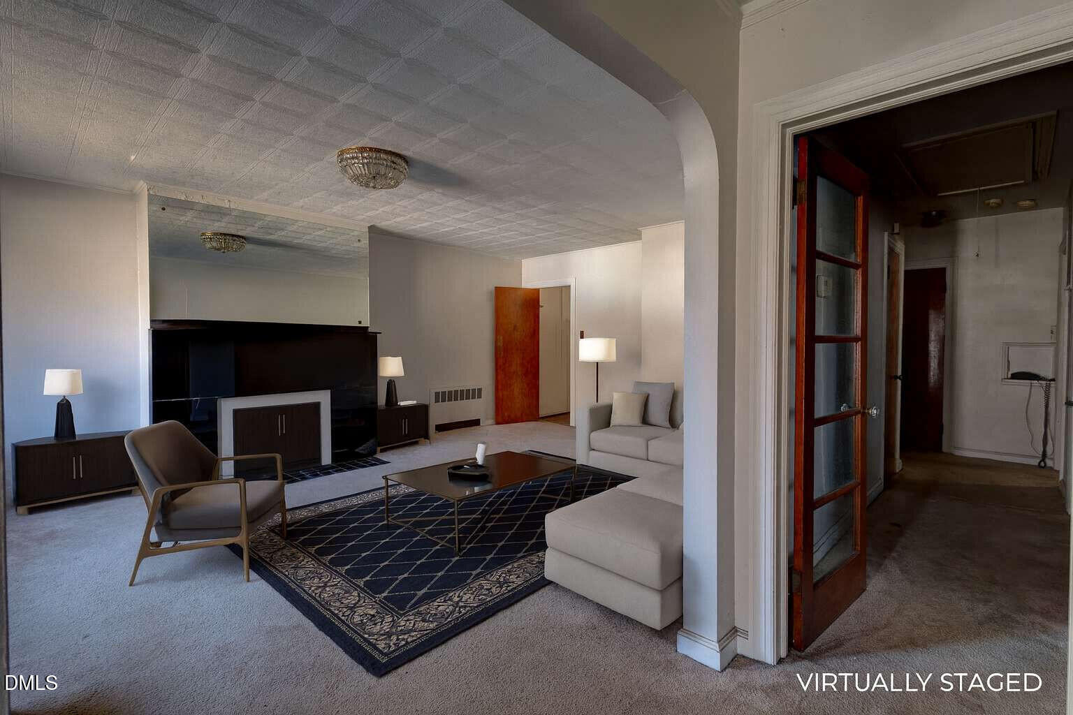 128 Nelson Street Durham, NC 27707 - Photo 2 of 23 a living room with furniture and a fireplace
