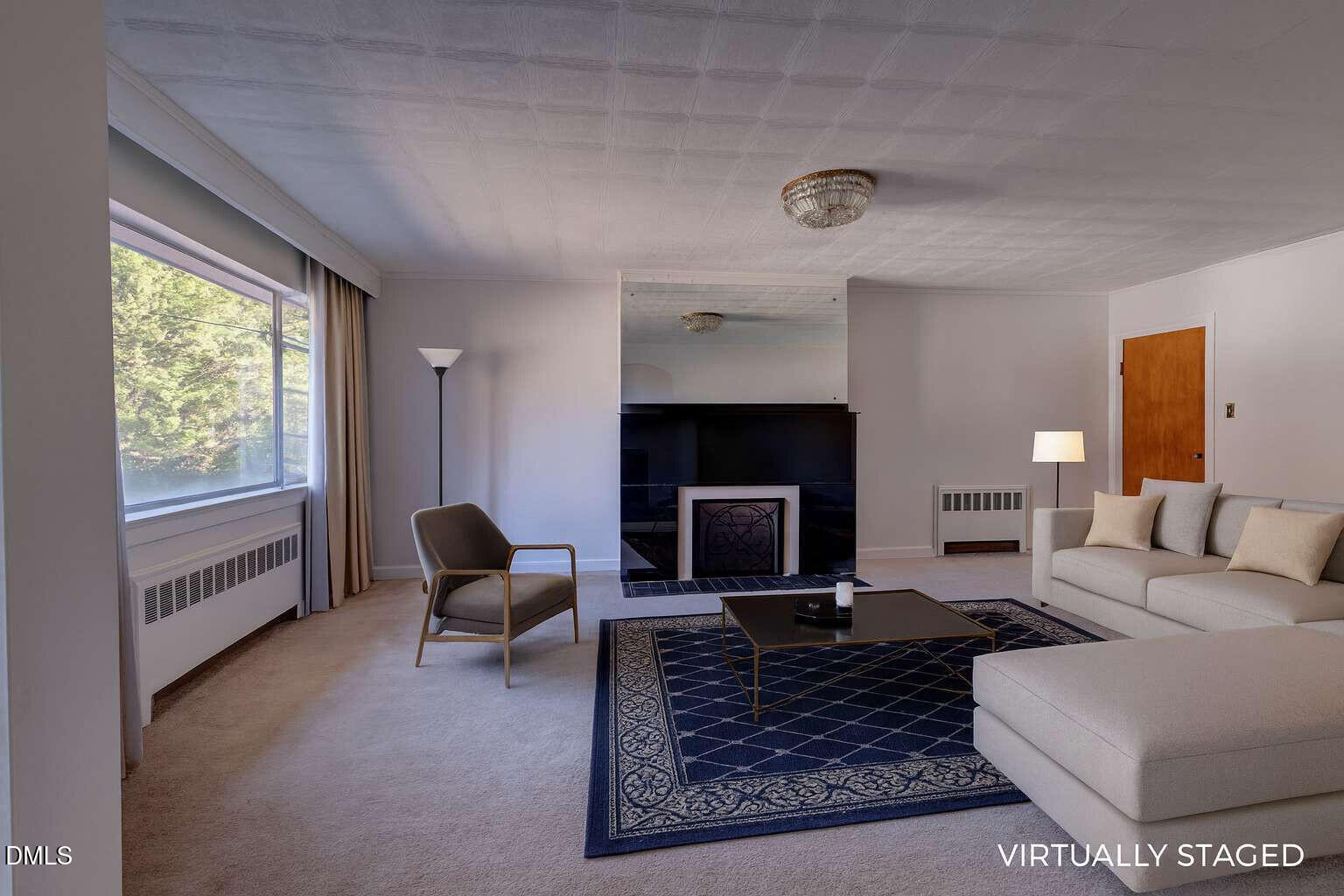 128 Nelson Street Durham, NC 27707 - Photo 4 of 23 a living room with furniture a rug a fireplace and a large window