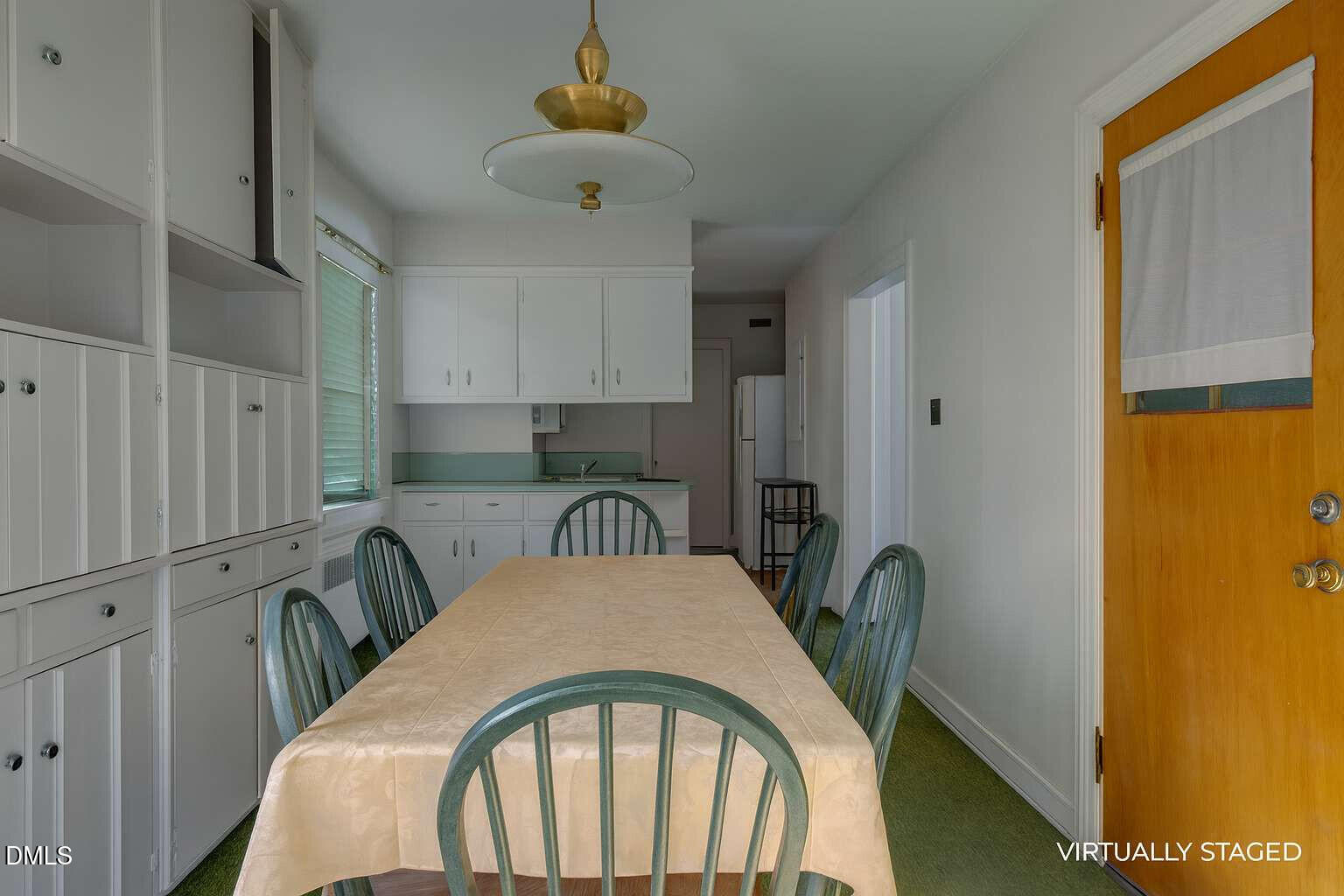 128 Nelson Street Durham, NC 27707 - Photo 8 of 23 a view of a dining room with furniture window and wooden floor
