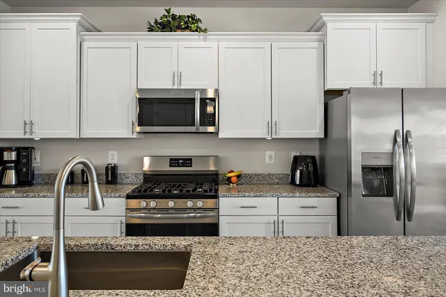 a bathroom with a sink mirror and toilet