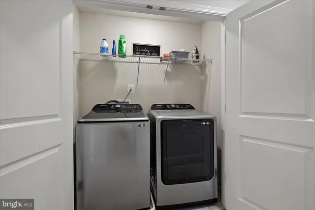 an aerial view of a house with a swimming pool