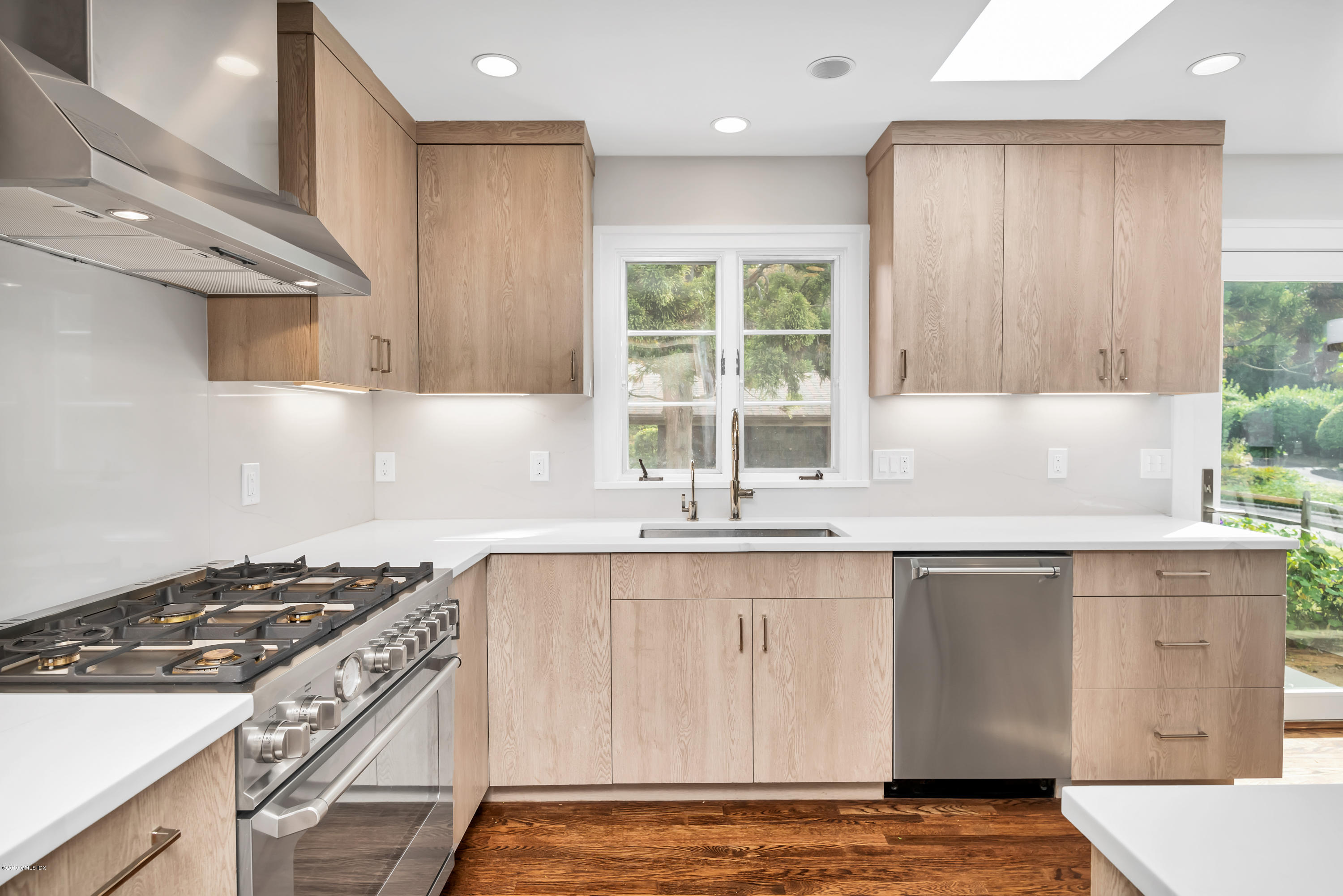 59 Stanwich Road Greenwich, CT 06830 - Photo 6 of 17 a kitchen with stainless steel appliances granite countertop a sink stove and cabinets
