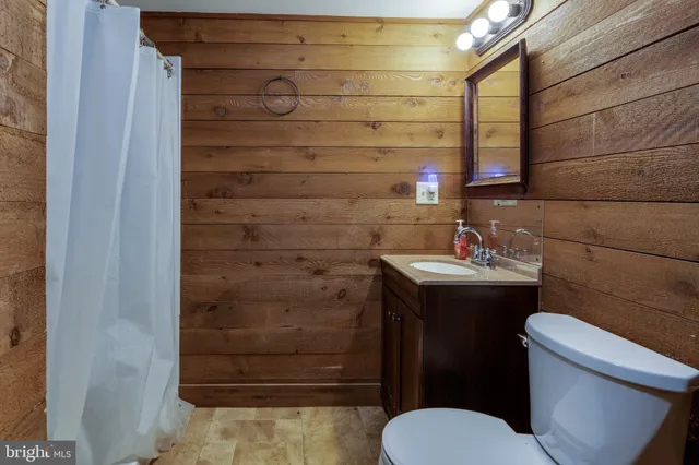 a bedroom with a bed and a mirror