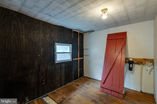 a hallway with a bed