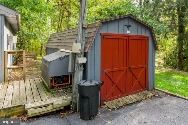 an aerial view of a house with yard and outdoor seating