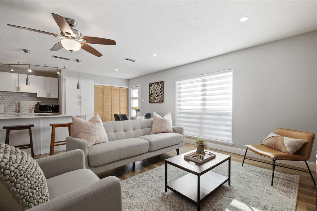 5112 Arbor Glen Road The Colony, TX 75056 - Photo 19 of 40 Living room featuring ceiling fan and dark hardwood / wood-style flooring