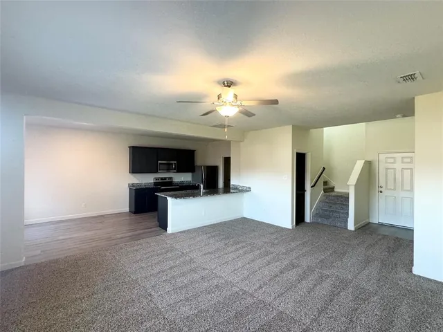 a view of a livingroom with a furniture