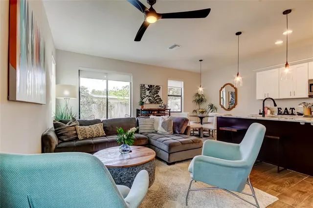 a living room with furniture and a large window