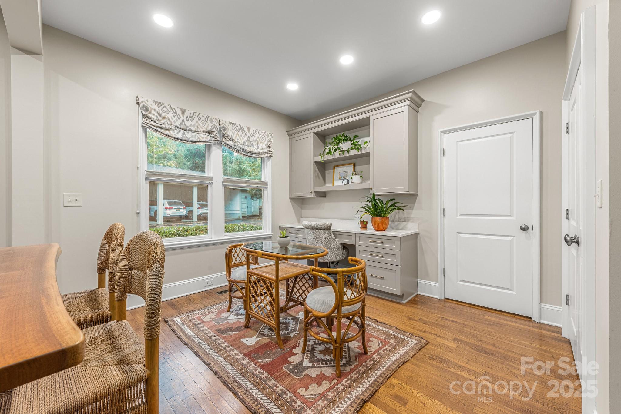 1025 Ardsley Road, Unit 104 Charlotte, NC 28207 - Photo 12 of 30 a view of a dining room with furniture window and outside view