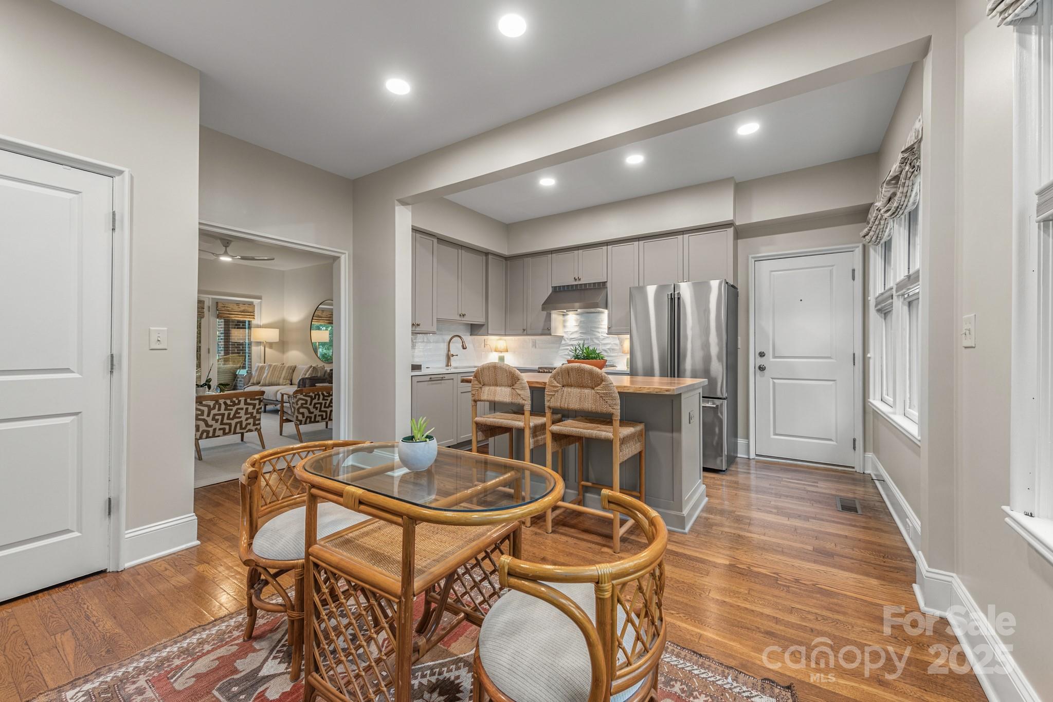 1025 Ardsley Road, Unit 104 Charlotte, NC 28207 - Photo 13 of 30 a kitchen with a table and chairs in it