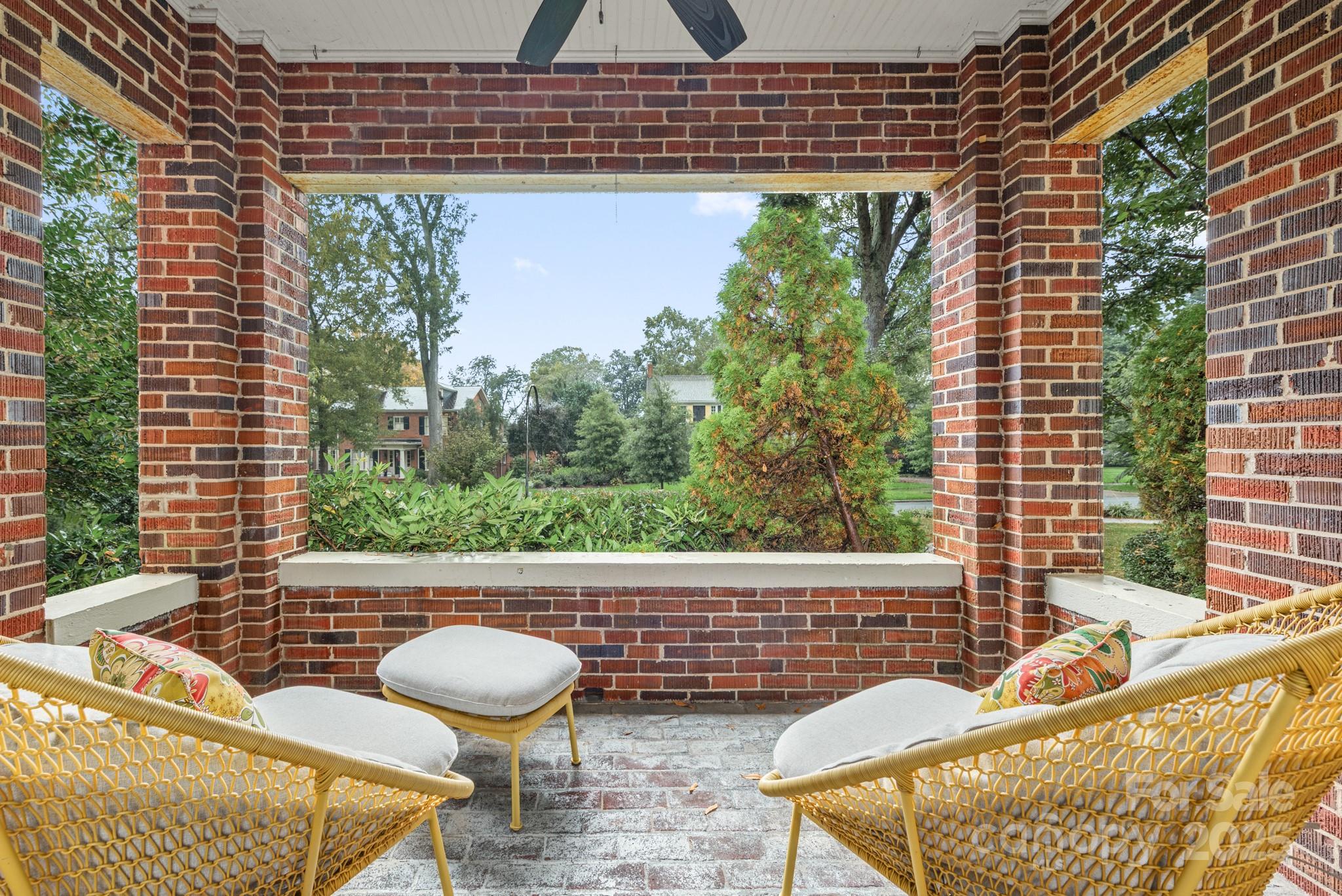 1025 Ardsley Road, Unit 104 Charlotte, NC 28207 - Photo 17 of 30 a view of a patio with a chairs and table in the patio