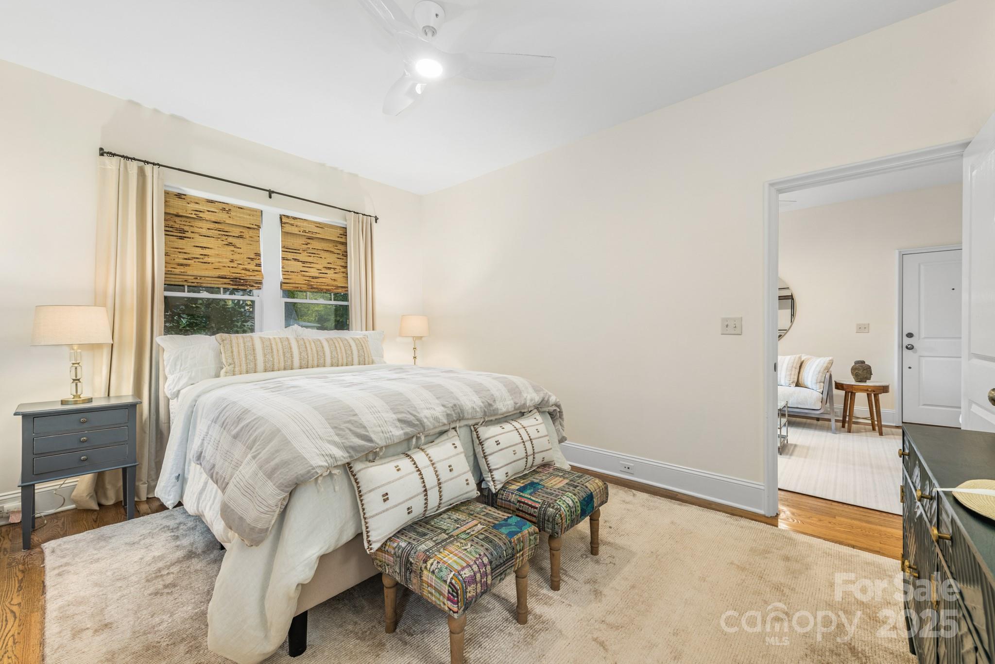 1025 Ardsley Road, Unit 104 Charlotte, NC 28207 - Photo 20 of 30 a bedroom with a bed and a table
