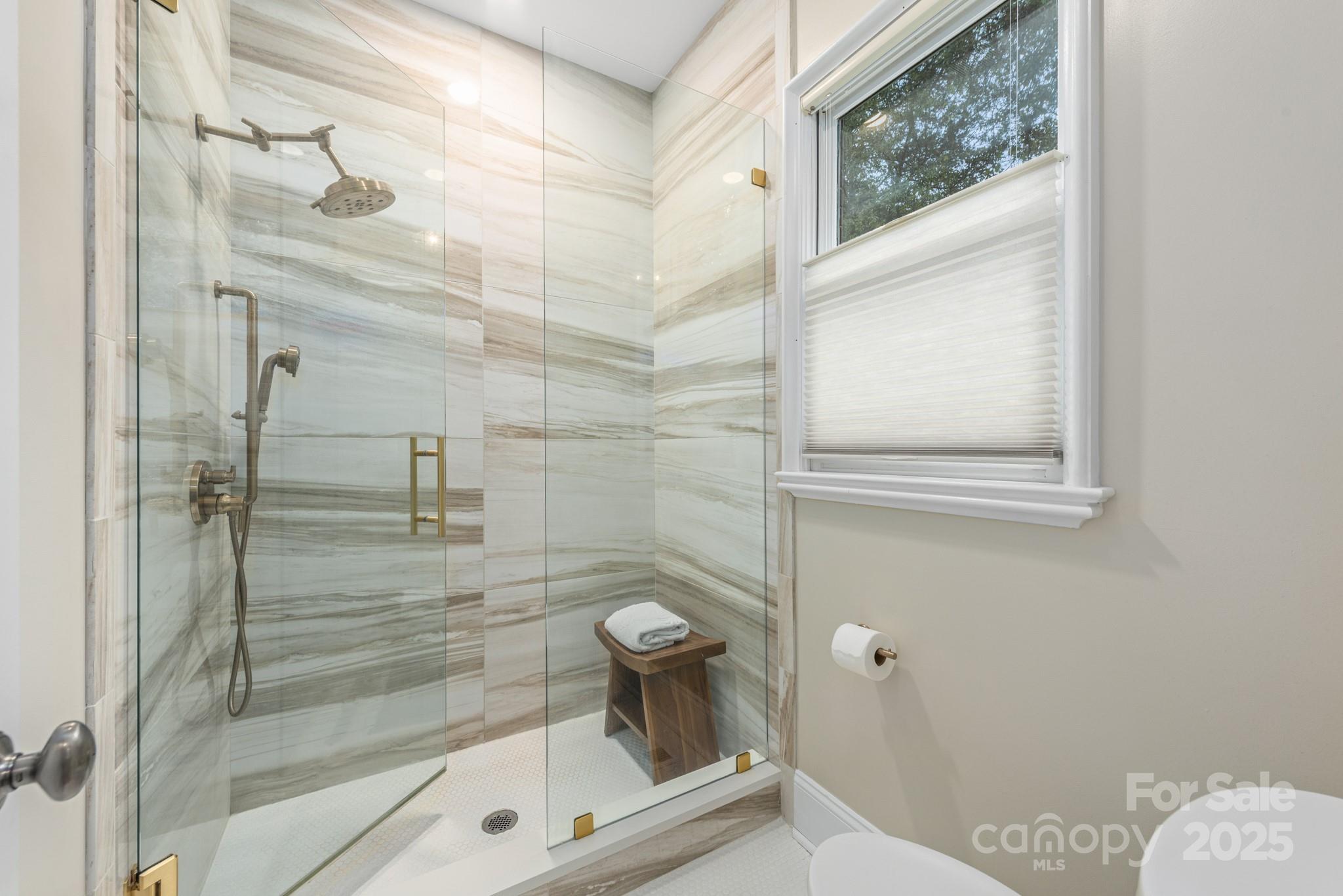 1025 Ardsley Road, Unit 104 Charlotte, NC 28207 - Photo 25 of 30 a bathroom with a shower
