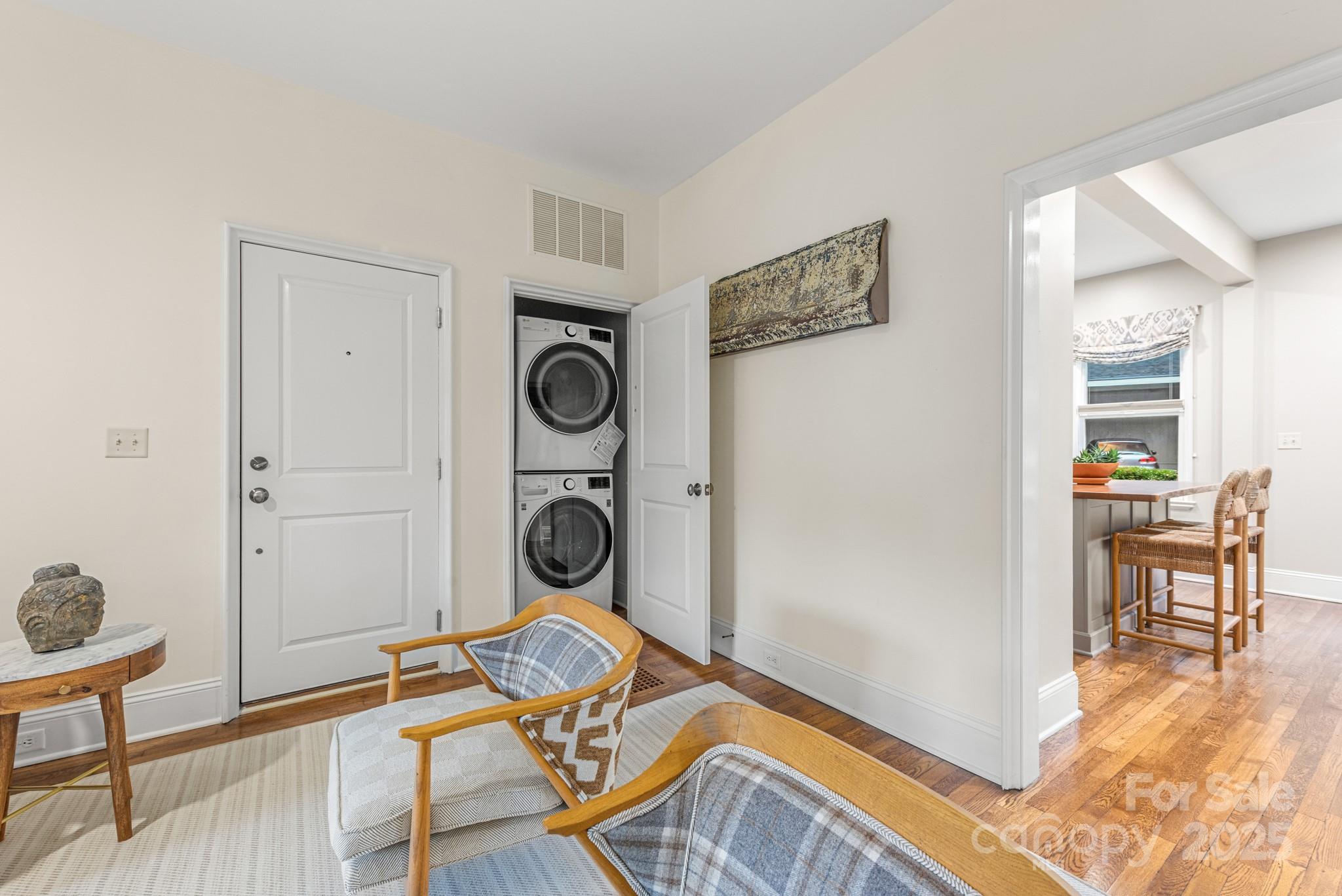 1025 Ardsley Road, Unit 104 Charlotte, NC 28207 - Photo 7 of 30 a view of a livingroom with furniture and washing machine