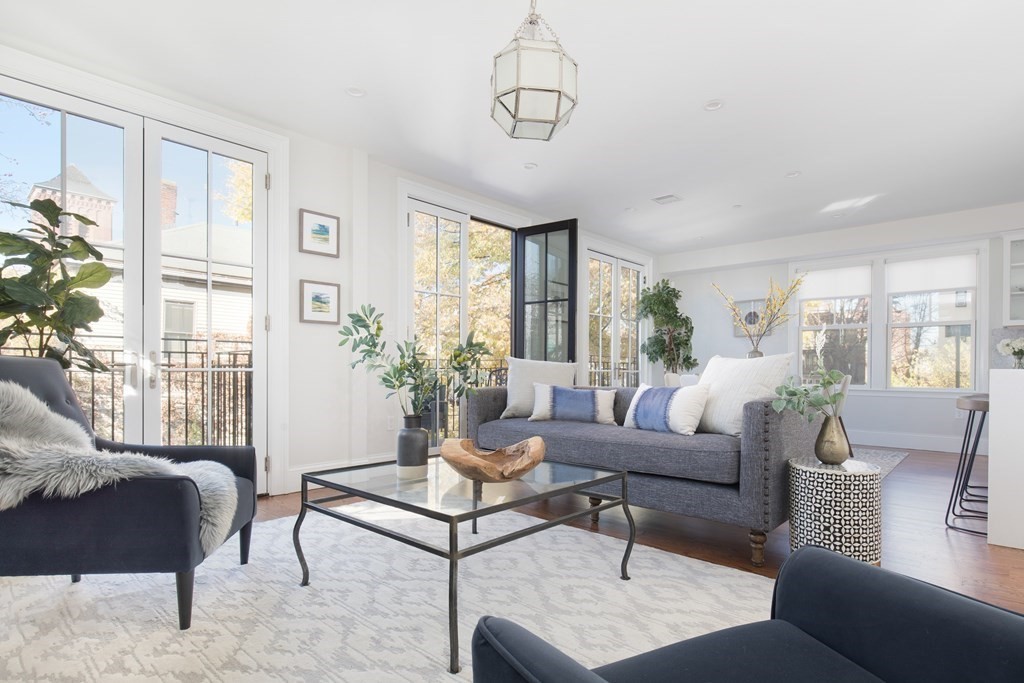 a living room with furniture and windows