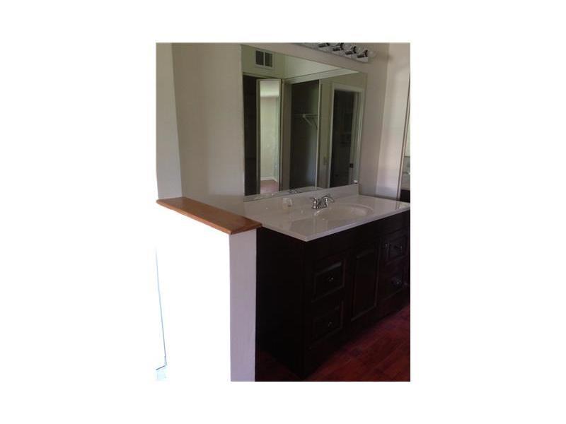 6542 Via Regina, Unit 11 Boca Raton, FL 33433 - Photo 11 of 11 a bathroom with a sink and a mirror