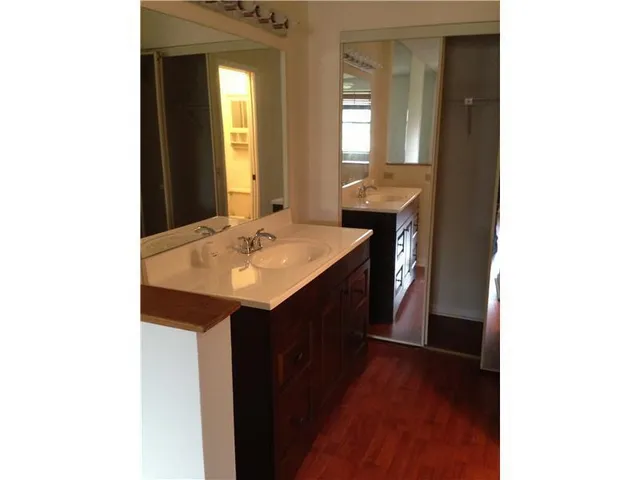 a en suite bathroom with a sink and a mirror