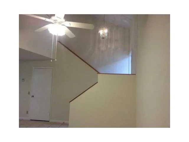 a view of a hallway with a bathroom