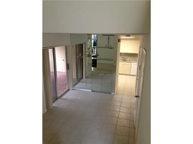 a black and white room with wooden floor