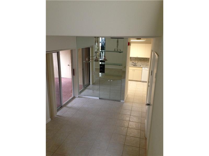 6542 Via Regina, Unit 11 Boca Raton, FL 33433 - Photo 8 of 11 a view of a hallway with a bathroom