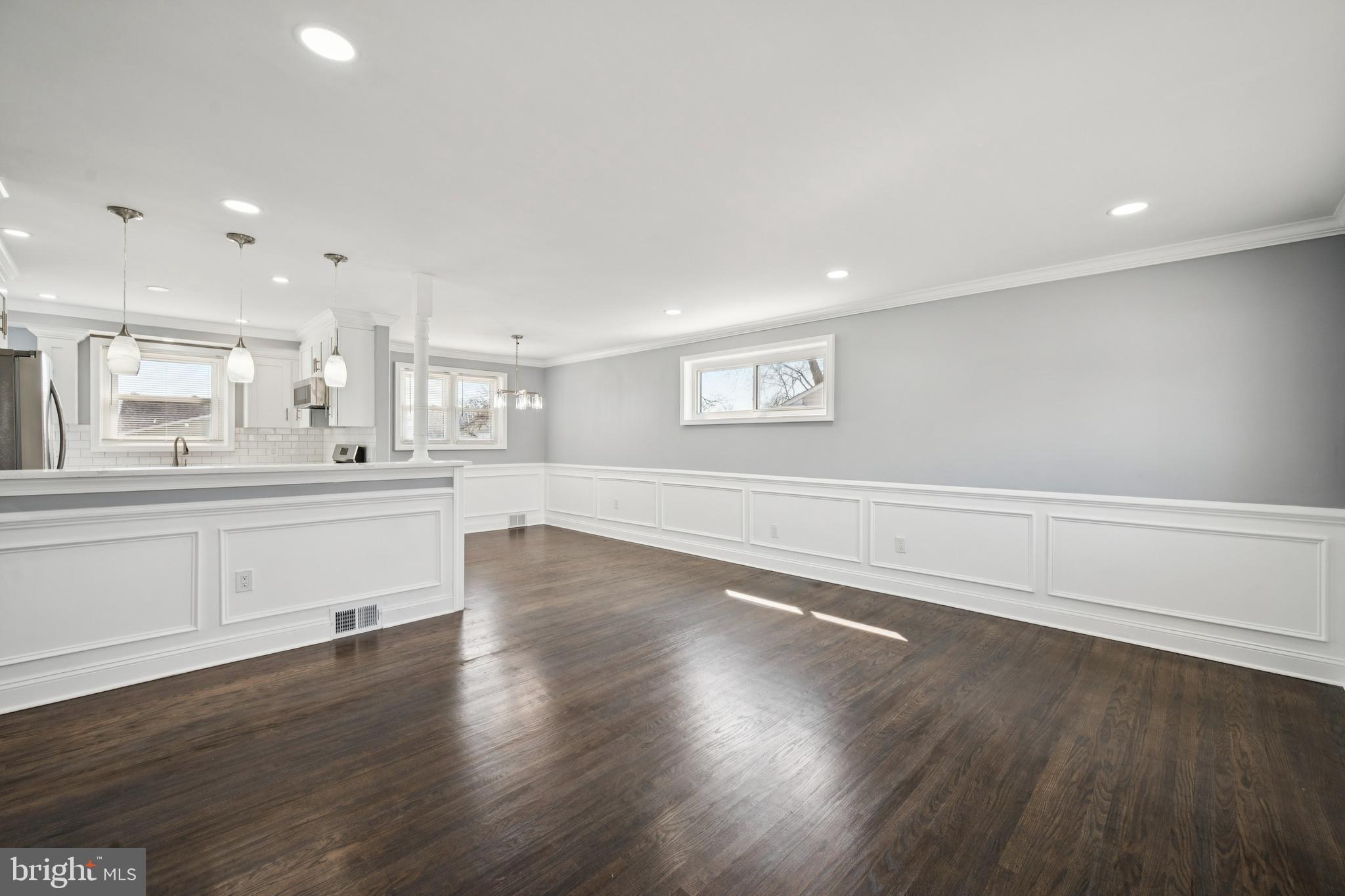 500 West Charles Street Palmyra, NJ 08065 - Photo 11 of 26 a large white kitchen with wooden floors and white walls