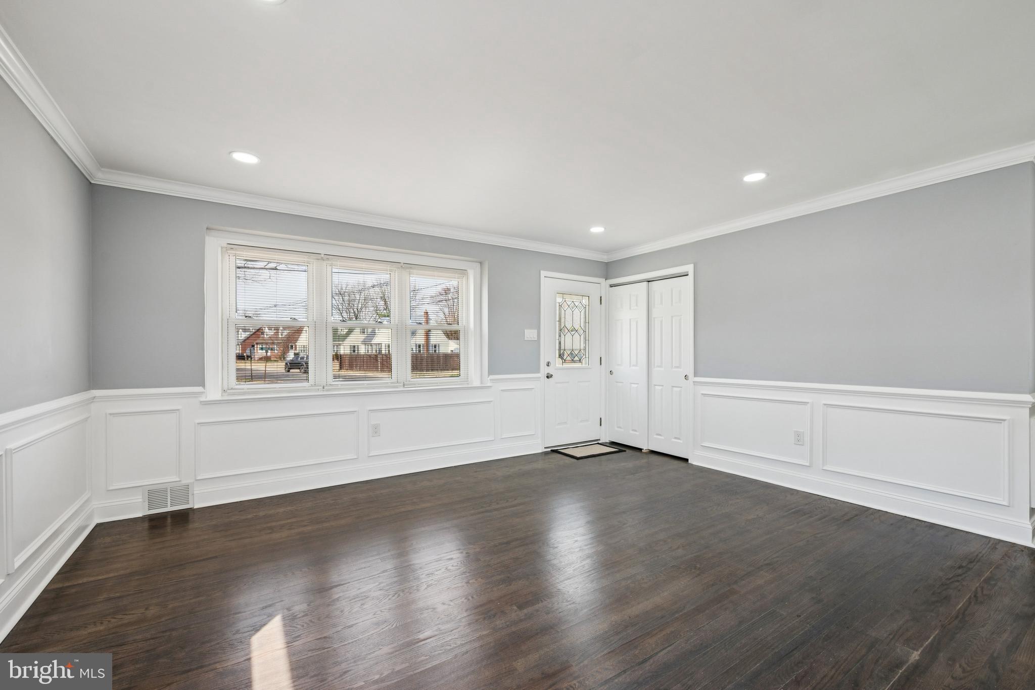 500 West Charles Street Palmyra, NJ 08065 - Photo 13 of 26 a view of an empty room with wooden floor and window