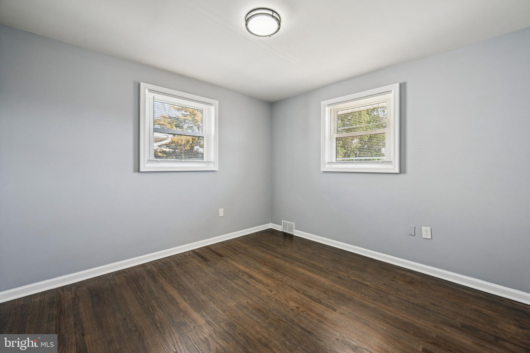 500 West Charles Street Palmyra, NJ 08065 - Photo 15 of 26 a view of an empty room with wooden floor and a window