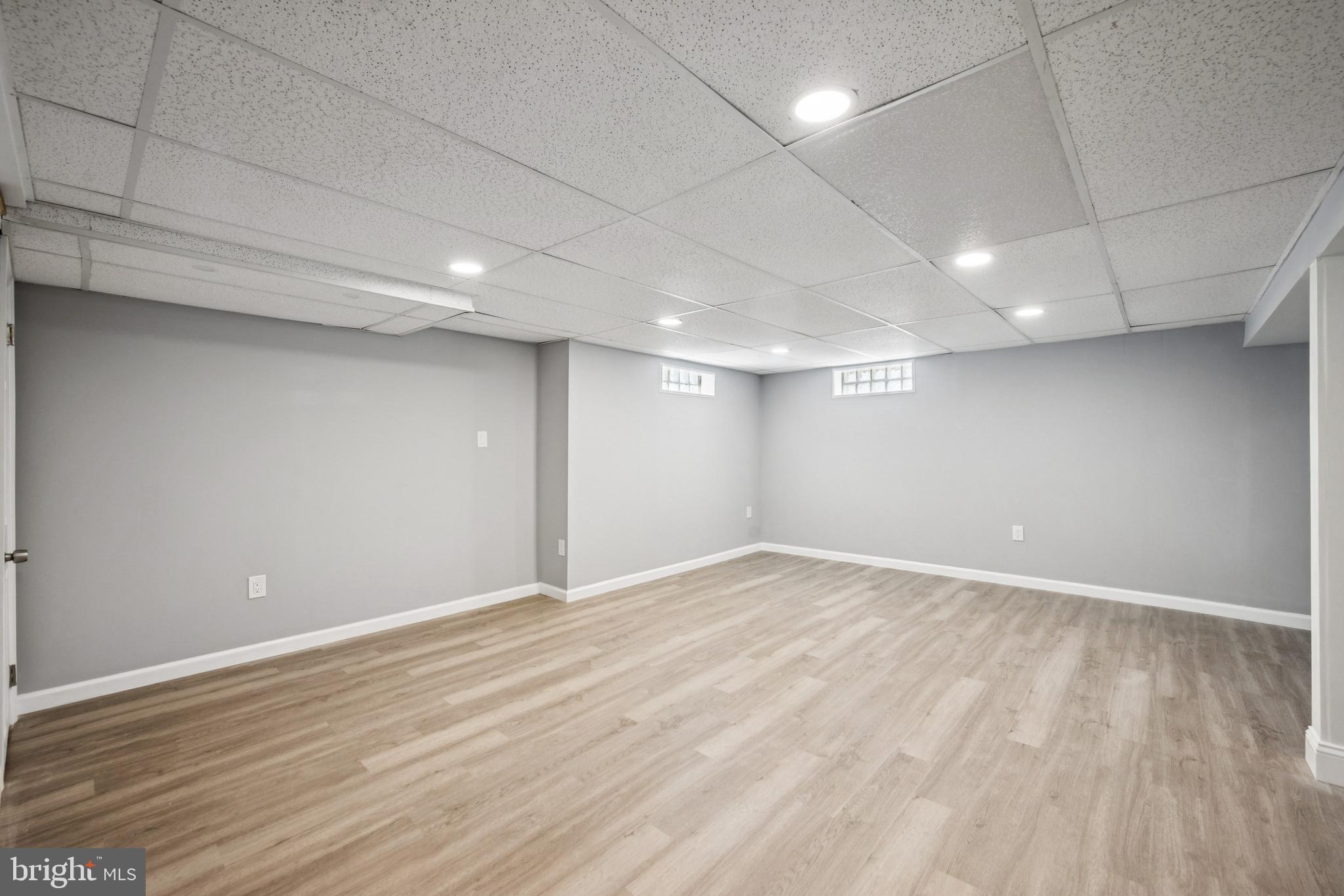 500 West Charles Street Palmyra, NJ 08065 - Photo 20 of 26 an empty room with wooden floor and windows