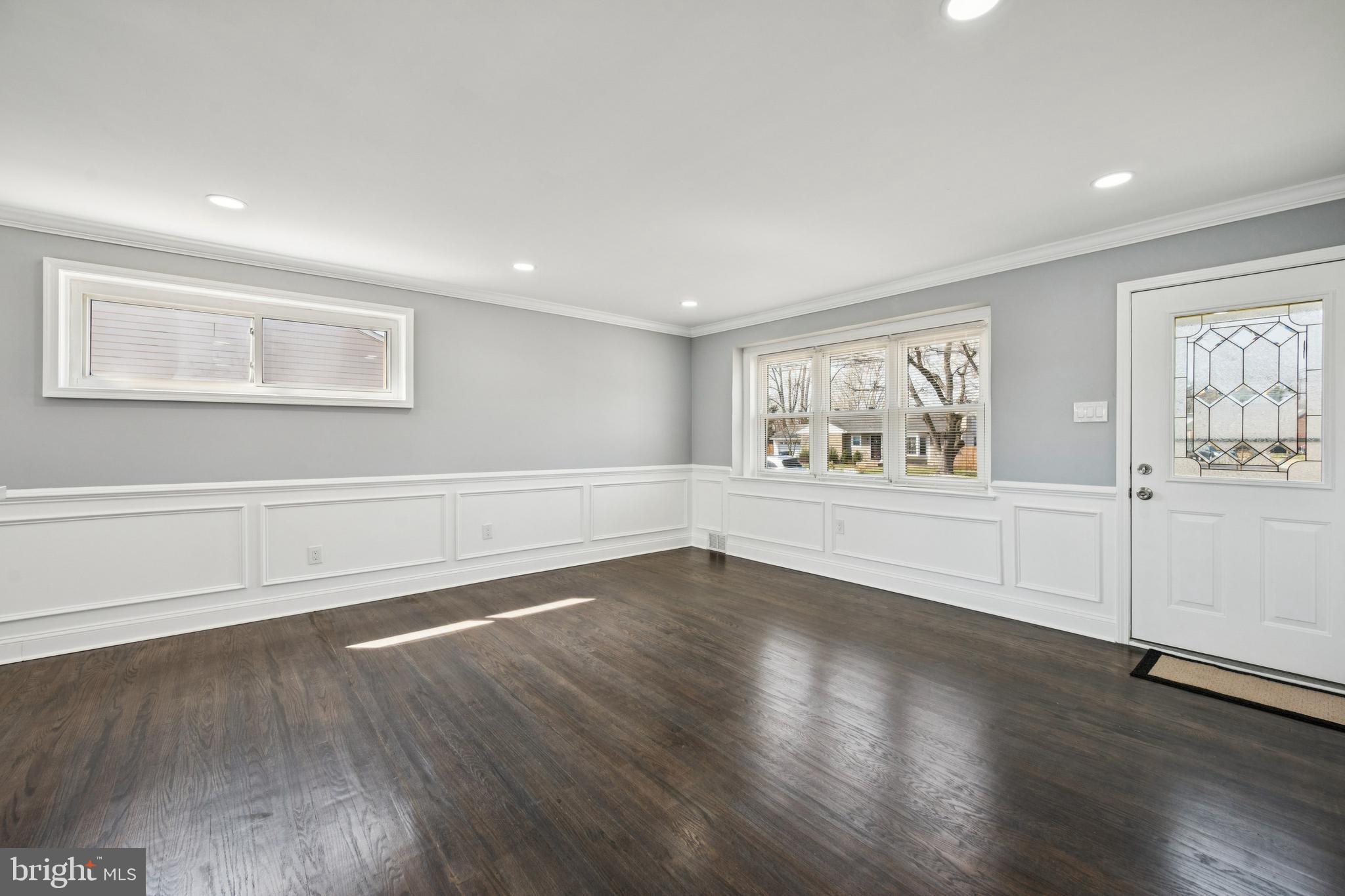 500 West Charles Street Palmyra, NJ 08065 - Photo 4 of 26 a view of an empty room with wooden floor and a window