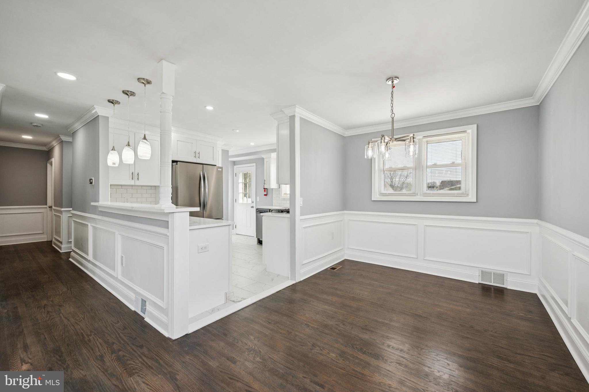 500 West Charles Street Palmyra, NJ 08065 - Photo 10 of 26 a view of kitchen with wooden floor and window