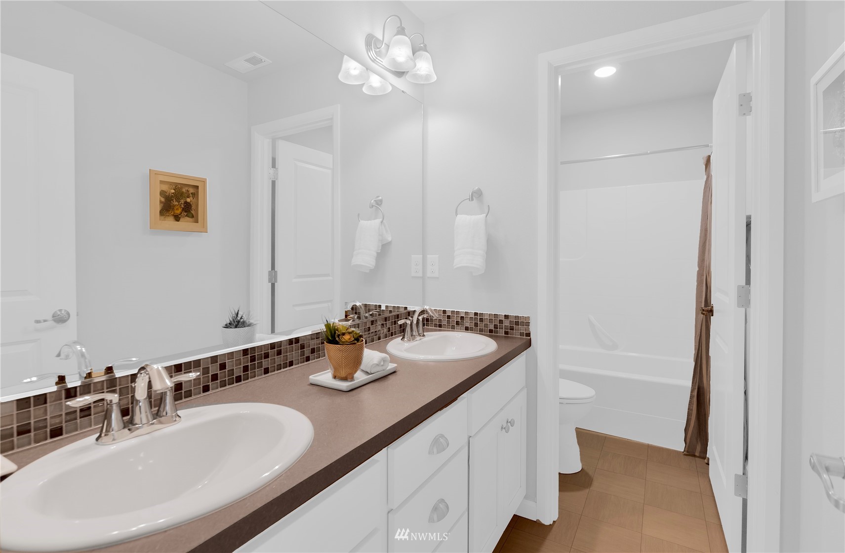 25 159th Place Southeast Bothell, WA 98012 - Photo 9 of 12 a bathroom with a sink a double vanity and a mirror