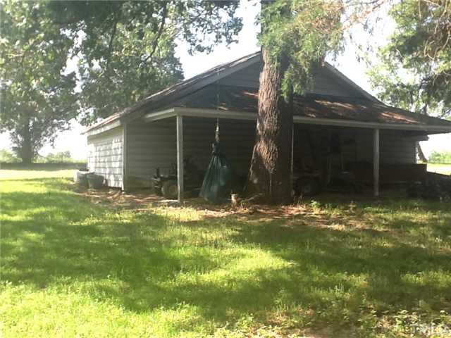 2565 Fairground Road Benson, NC 27504 - Photo 13 of 22 a view of a back yard of the house