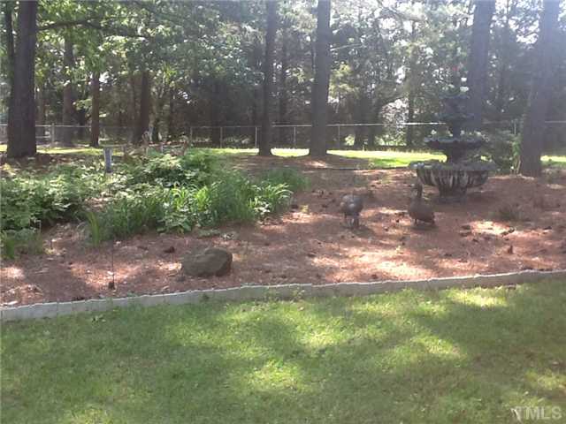 2565 Fairground Road Benson, NC 27504 - Photo 18 of 22 a view of a yard with swimming pool