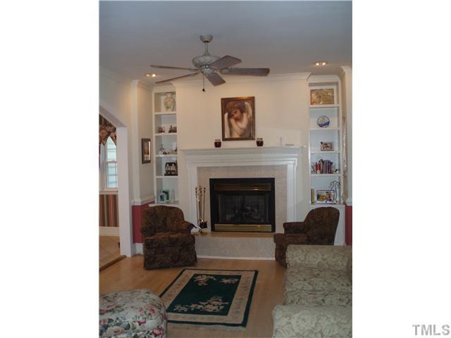 2565 Fairground Road Benson, NC 27504 - Photo 3 of 22 a living room with furniture and a fireplace