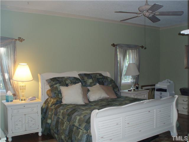 2565 Fairground Road Benson, NC 27504 - Photo 5 of 22 a bedroom with a bed and a window
