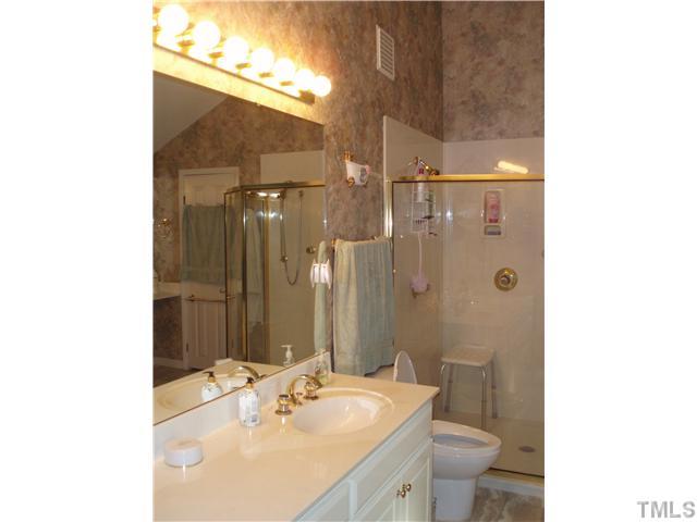 2565 Fairground Road Benson, NC 27504 - Photo 7 of 22 a bathroom with a sink toilet and shower