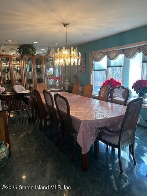 1061 Woodhull Avenue Staten Island, NY 10312 - Photo 4 of 8 a view of a dining room with furniture and chandelier