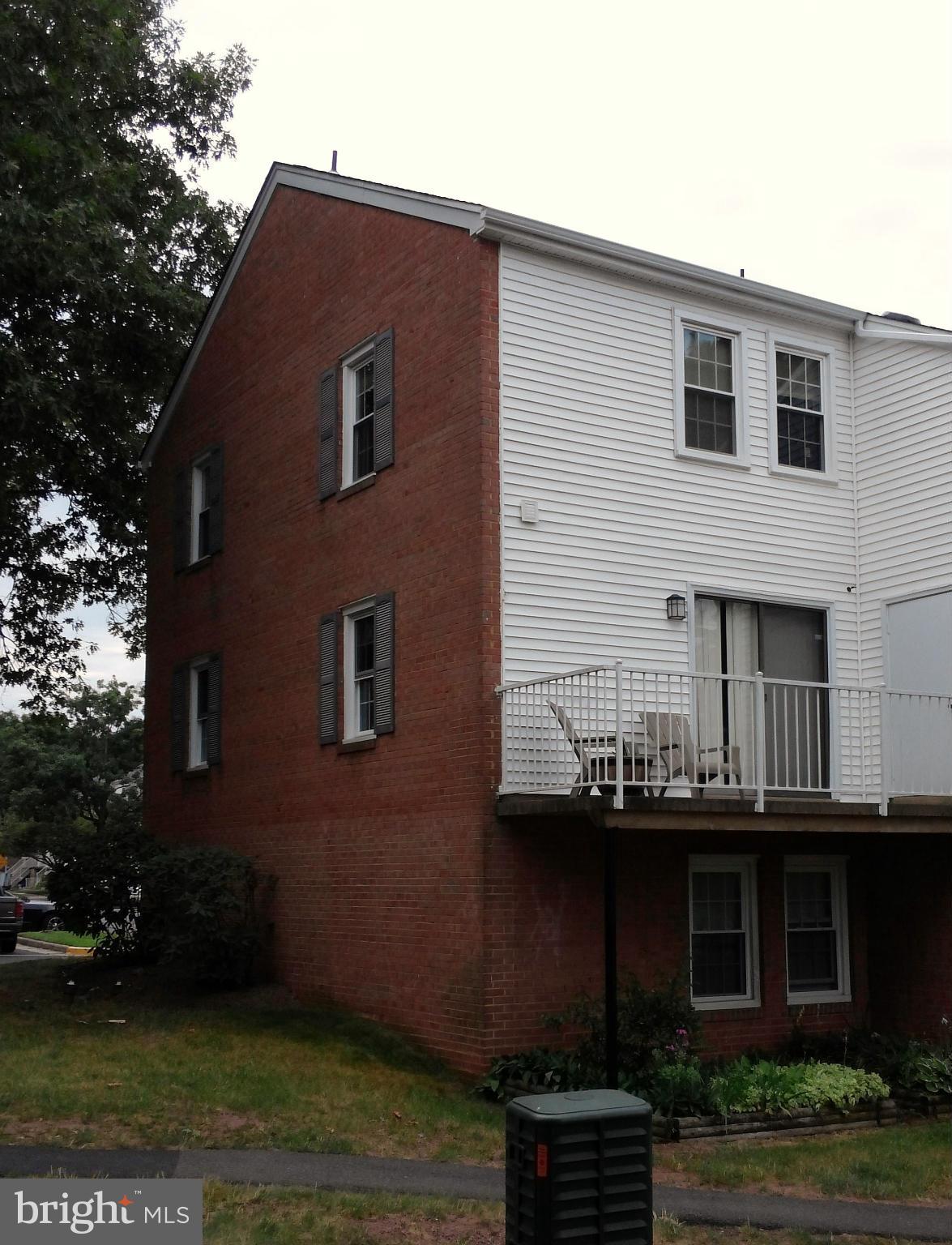 14591 Golden Oak Road Centreville, VA 20121 - Photo 2 of 21 a front view of a house with a garden