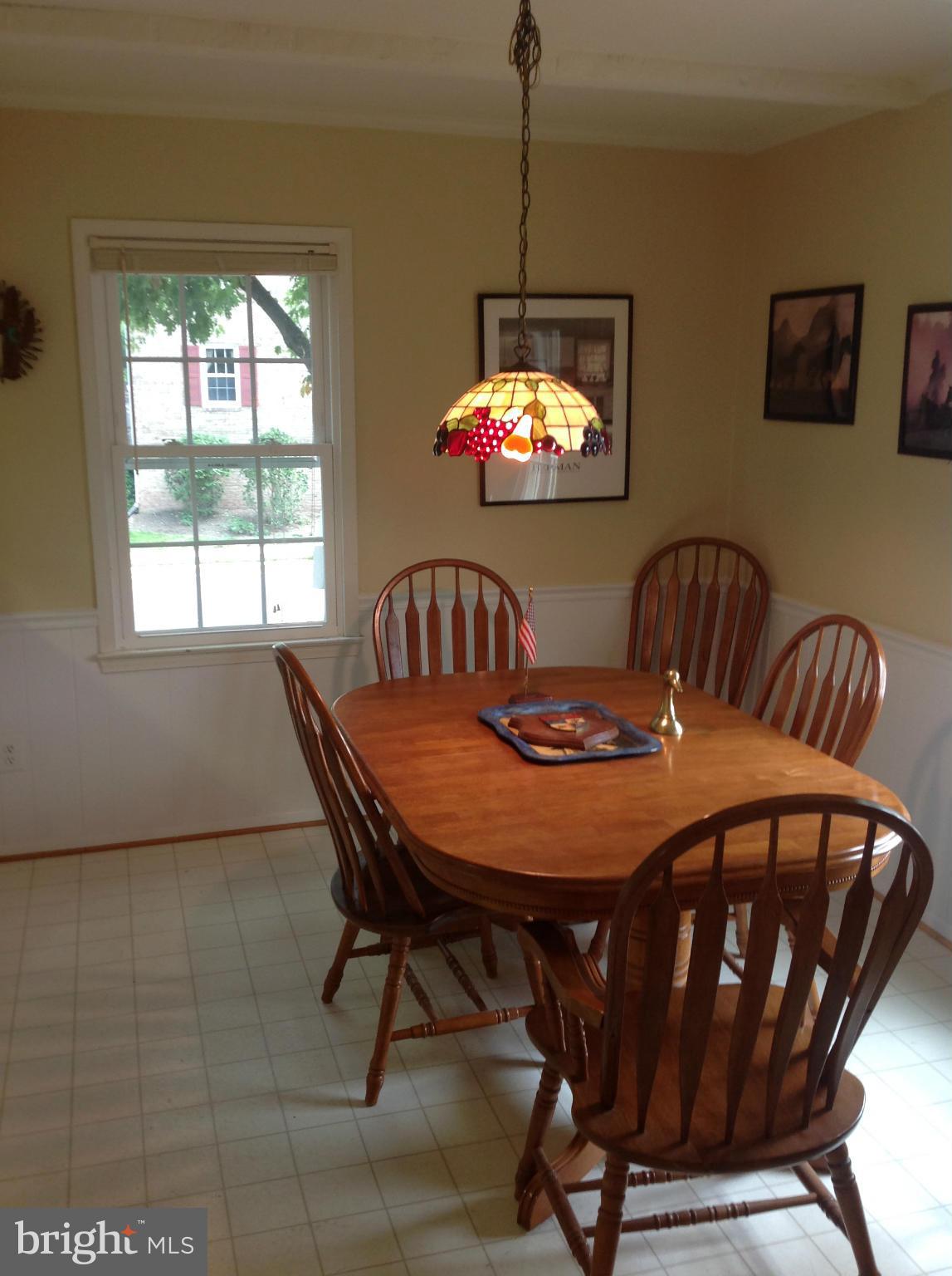 14591 Golden Oak Road Centreville, VA 20121 - Photo 11 of 21 a view of a dining room with furniture and chandelier