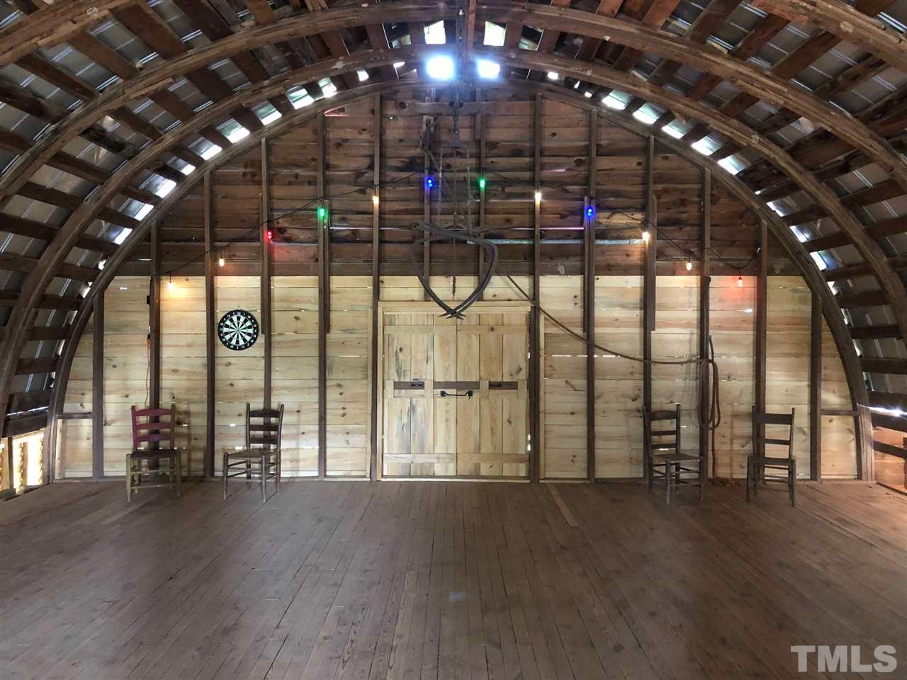 224 Roy Pierce Road Timberlake, NC 27583 - Photo 18 of 23 What an incredible space. 52x30, over 1500sf, high ceilings with a round roof. You'll have to see this to appreciate the potential of it. There's an old hay trolley that runs through the entire loft.