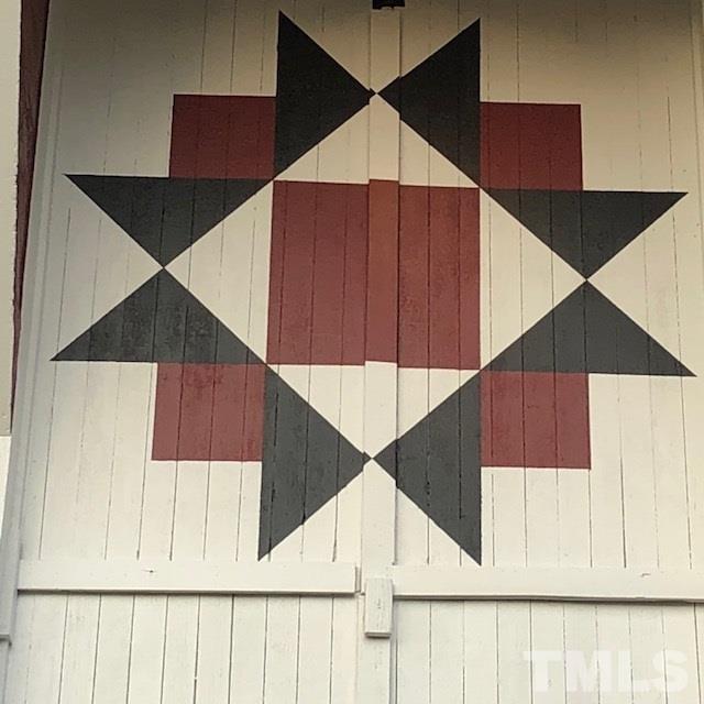224 Roy Pierce Road Timberlake, NC 27583 - Photo 8 of 23 This quilt was hand painted on the loft doors of the barn.