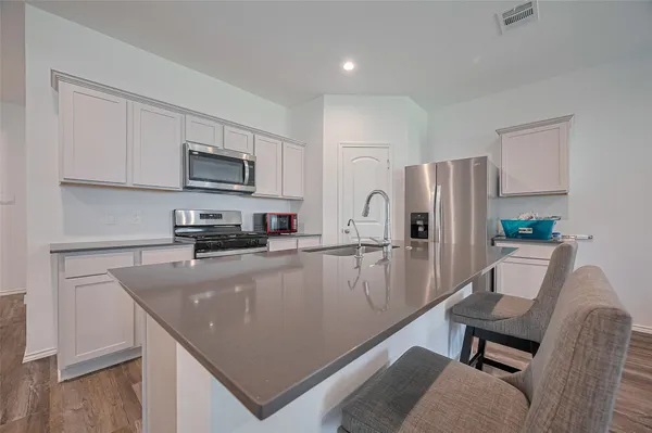 a bedroom with a bed and chair