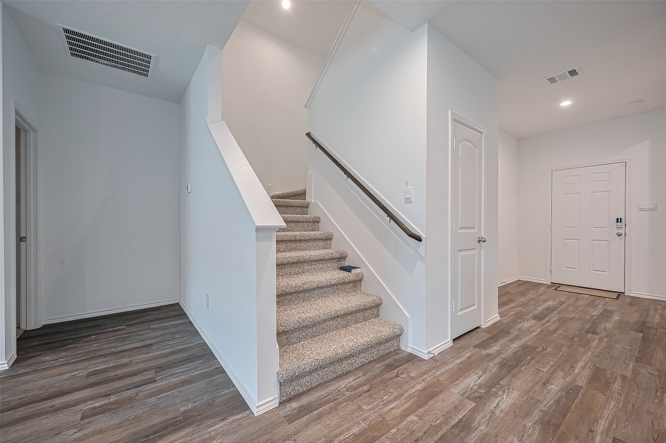 40434 Basalt Elm Road Magnolia, TX 77354 - Photo 14 of 41 a view of a hallway with wooden floor and entryway