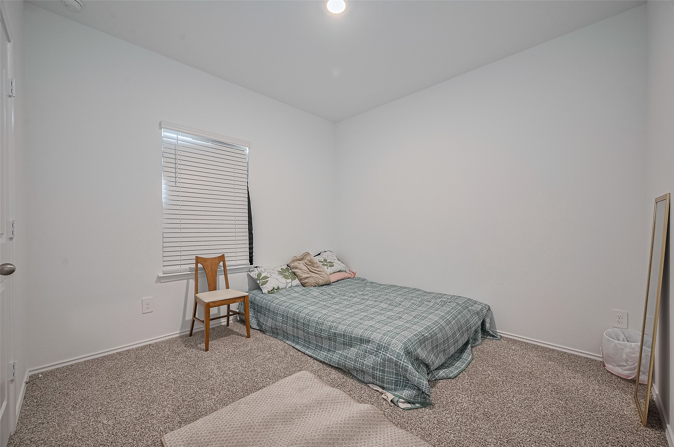 40434 Basalt Elm Road Magnolia, TX 77354 - Photo 16 of 41 a bedroom with a bed and chair
