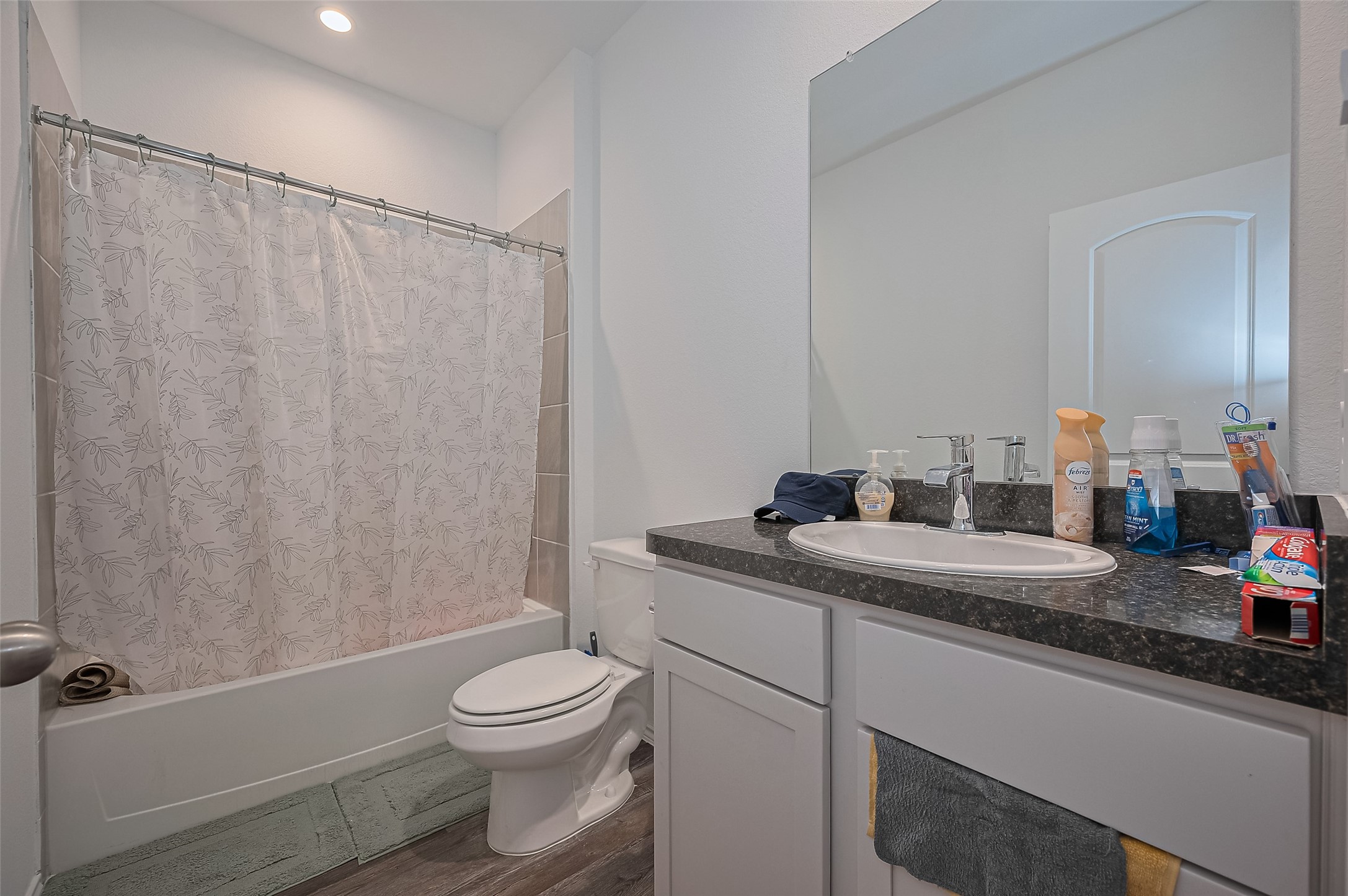 40434 Basalt Elm Road Magnolia, TX 77354 - Photo 17 of 41 a bathroom with a granite countertop sink a toilet and shower